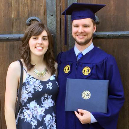 Daniel with college diploma